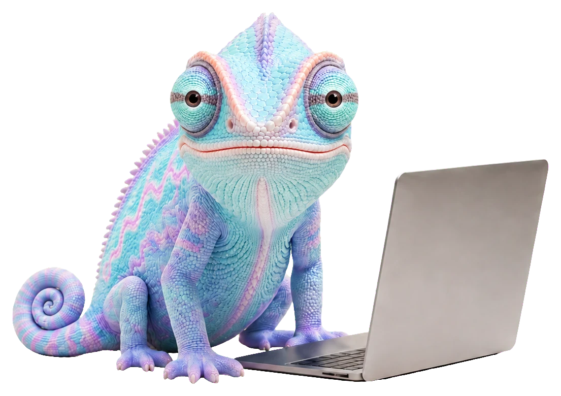 Adapt, the Adaptius chameleon, sitting beside a laptop and looking at you as if you just sat down together